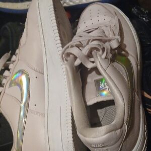 Nike Low-Top Sneakers in Light Pink with Iridescent Swoosh